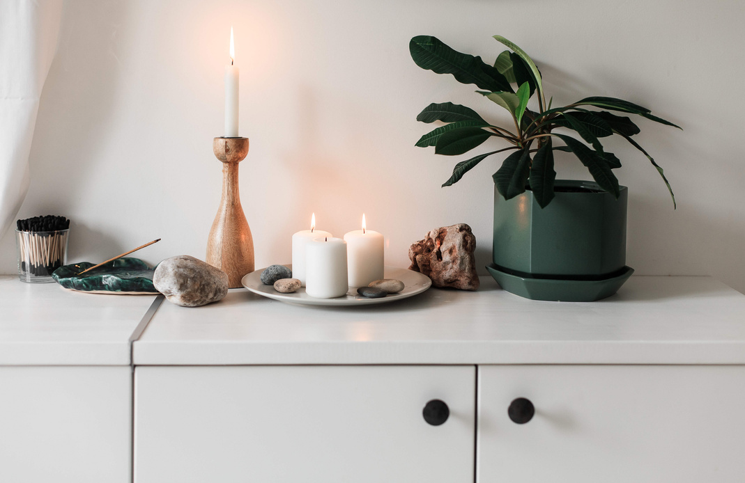 Candles, Houseplant, and Decor on a Table